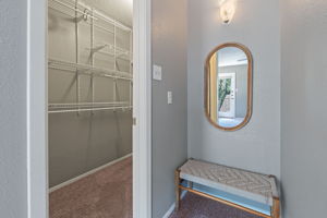 Extra storage/make-ready space near primary bedroom's  large walk in closet