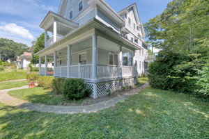 Covered Porch Wraps Around for Access to Side Yard