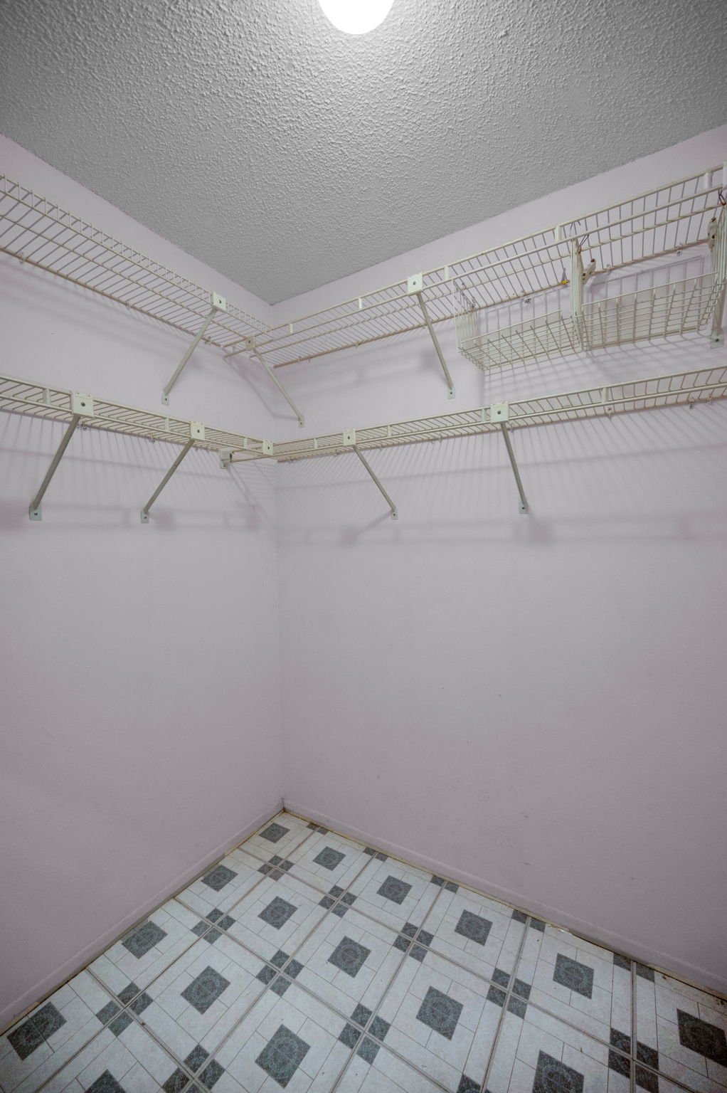 Primary Bedroom Walk-in Closet1b