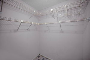 Primary Bedroom Walk-in Closet1a