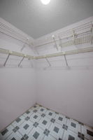 Primary Bedroom Walk-in Closet1b