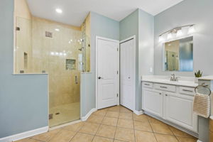 Walk in tiled shower.