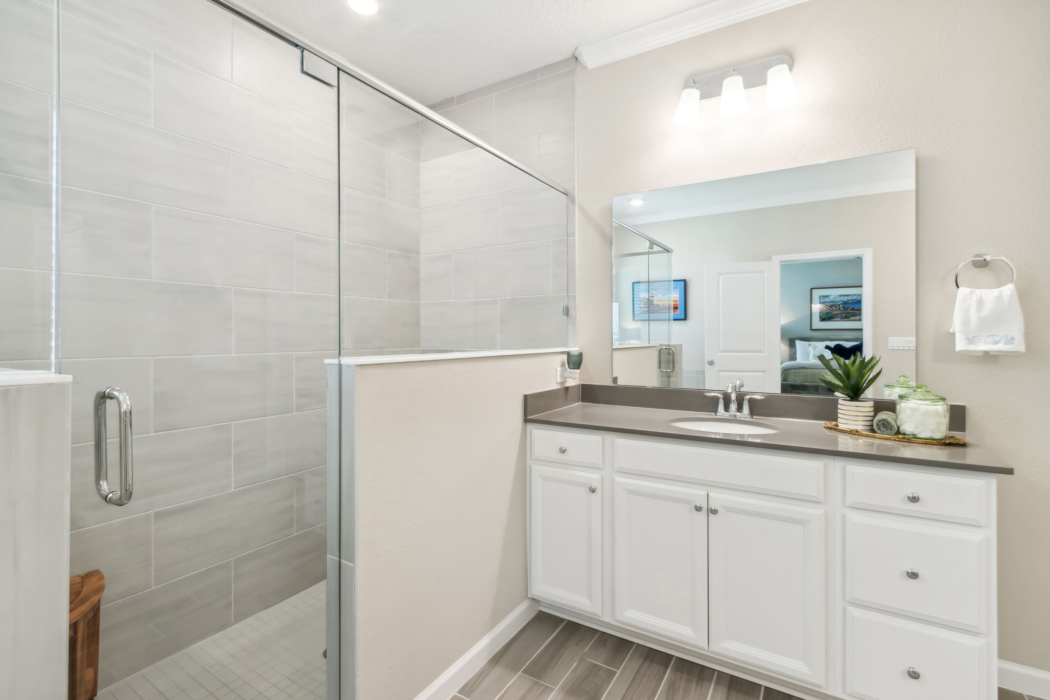 ...and a sleek shower design with tasteful floor-to-ceiling tile