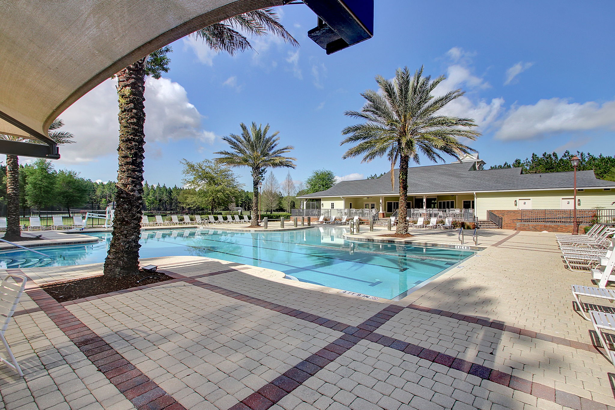 ...this large pool entices with multiple sundecks ...