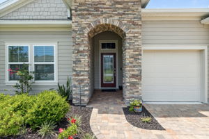 Elegant architectural features and stone accents give it great curb appeal ...