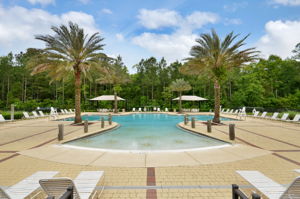 and first class amenities, like this resort-style pool ...