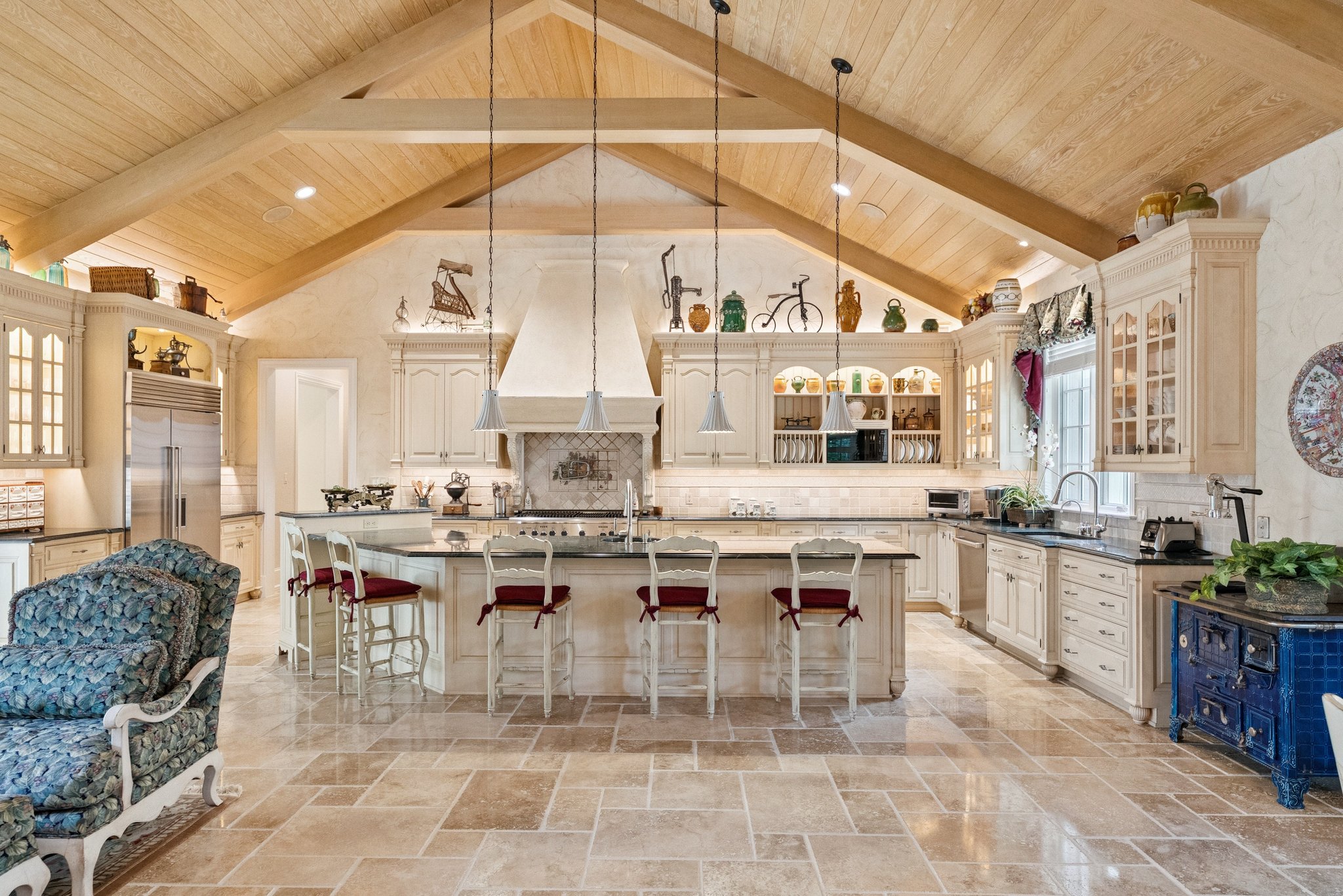 Gourmet Chef's Kitchen with Beamed Ceilings