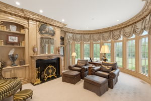 Library with Wall of Windows and Fireplace