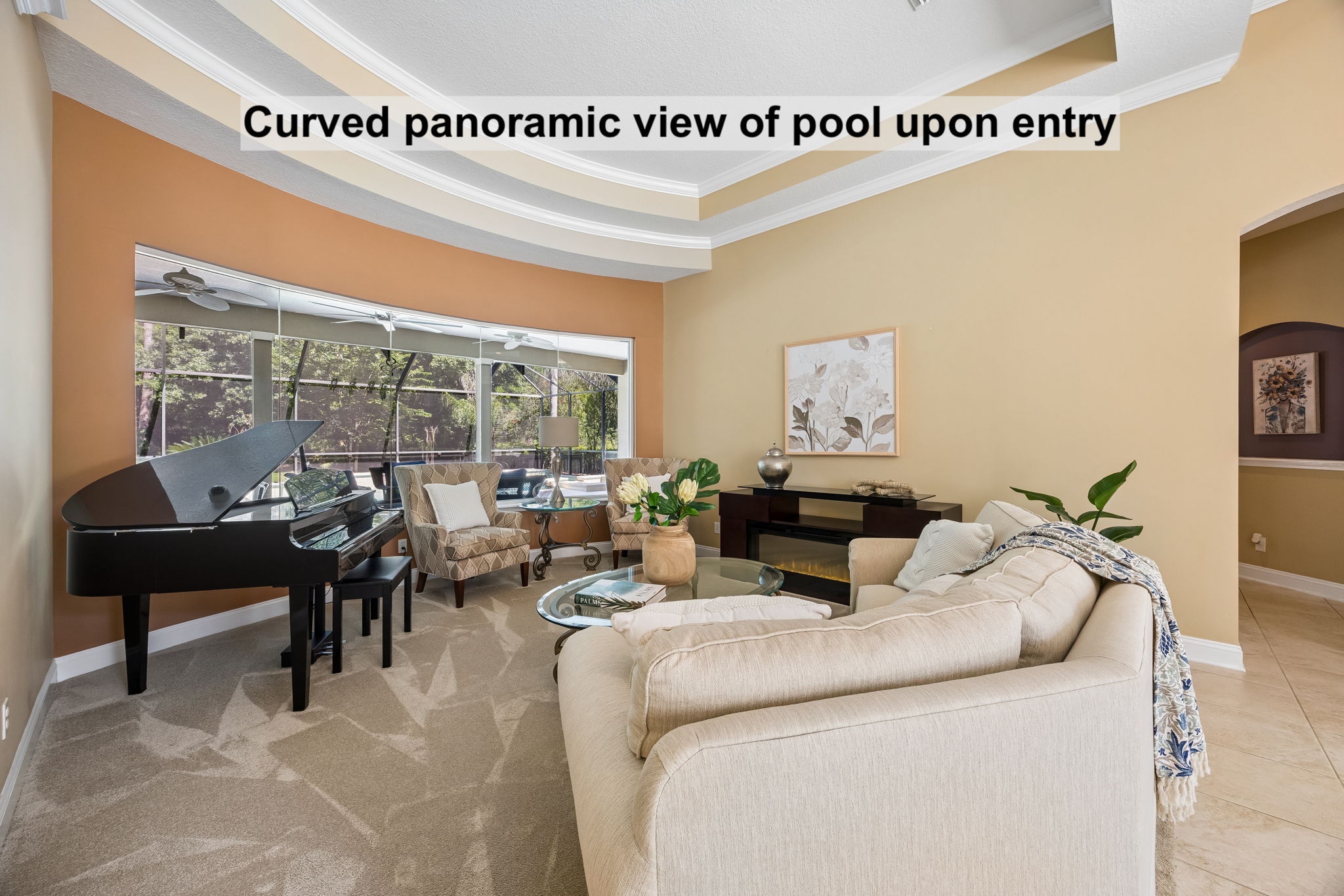 ... where a curved wall of glass draws the eye outward and offers a panoramic view of the pool from the moment you arrive