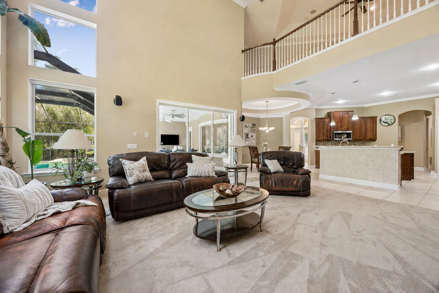 ... while remaining effortlessly connected to the kitchen, loft above, and the screened pool just beyond
