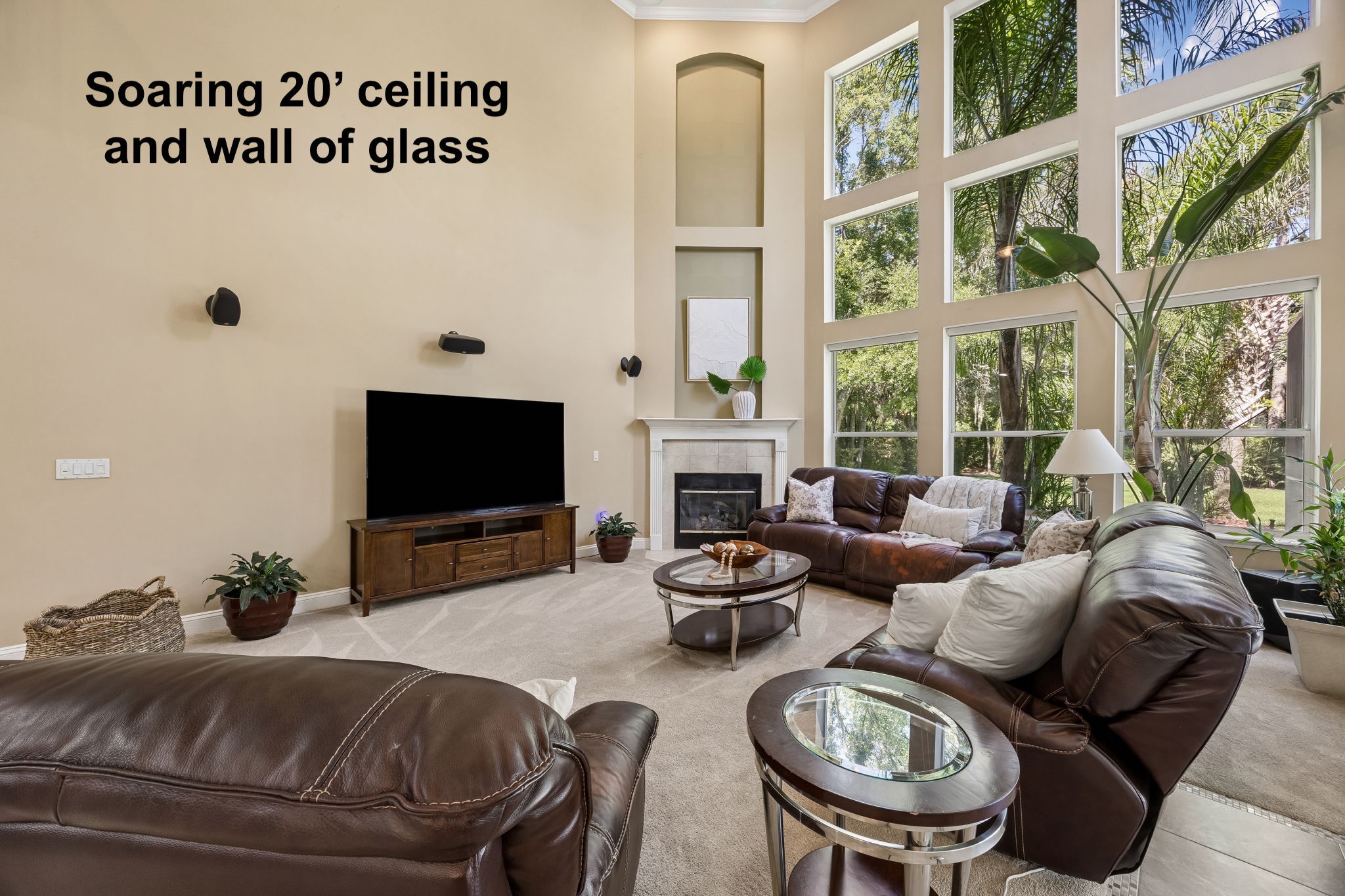 ... wrapped in a striking wall of glass and nearly 20-foot ceilings that fill the room with light