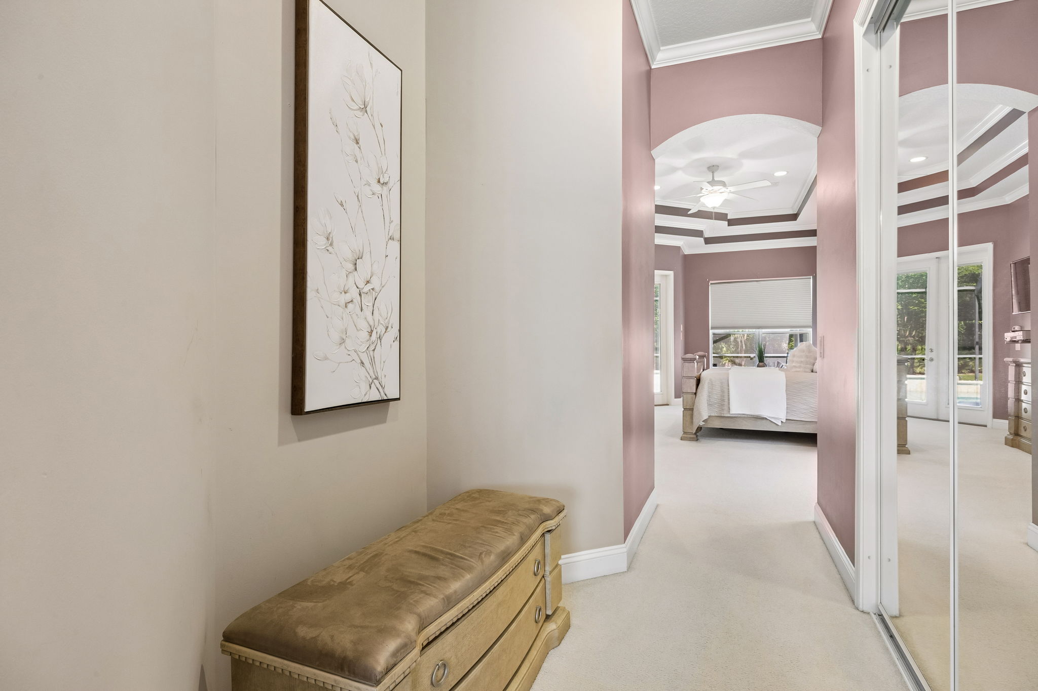 … and a separate hallway with dual walk-in closets creates a quiet transition to the primary bath.