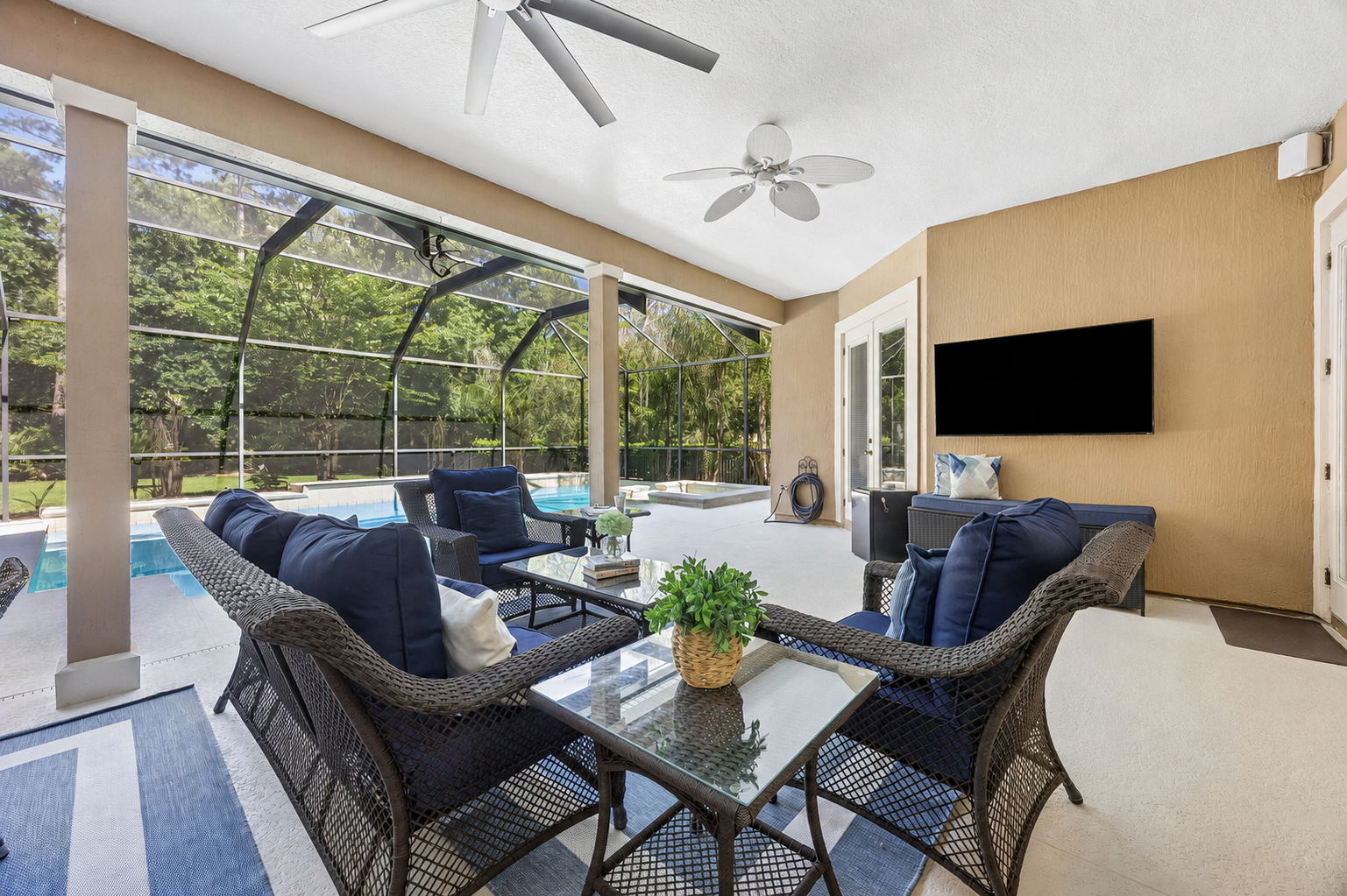 A mounted TV and gas stub for grilling or a future summer kitchen add even more function to the lanai ...