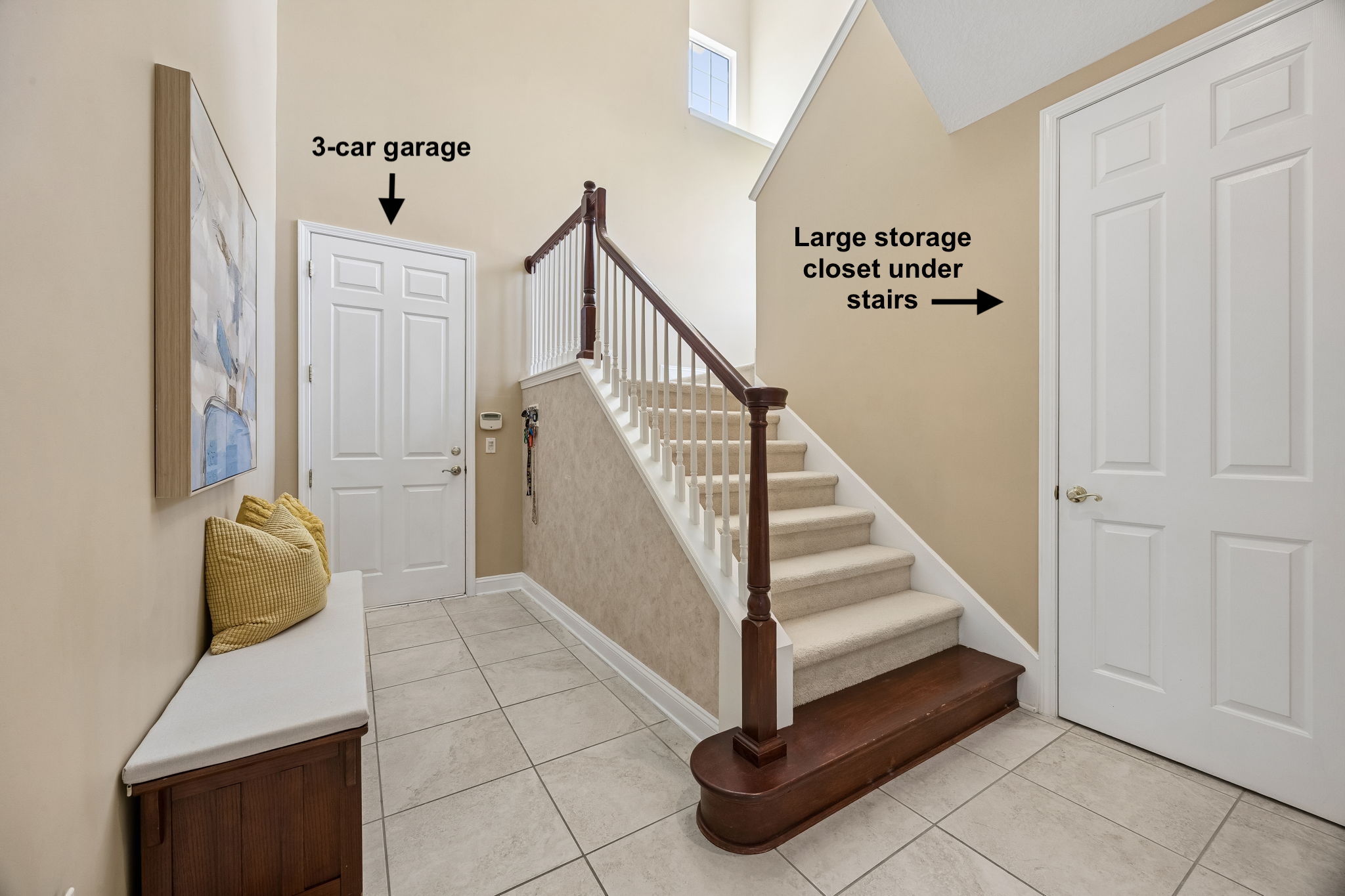 A practical transition hall leads to the 3-car garage, with a large under-stair storage closet tucked nearby ...