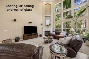 ... wrapped in a striking wall of glass and nearly 20-foot ceilings that fill the room with light