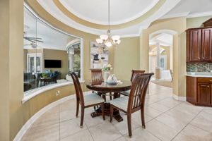 A breakfast nook is tucked between the kitchen and main living space for a natural sense of connection ...