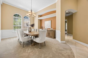 … where tall arched windows, paneled wainscoting, and a softly defined niche create an elegant setting for dinner and celebration.