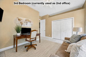 Currently styled as an office, this second guest bedroom offers the proportions and closet space to easily function as comfortable sleeping quarters.