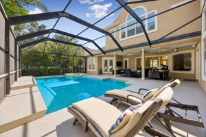 By day, there is room to swim, lounge, dine, and move easily between the lanai and the water ...