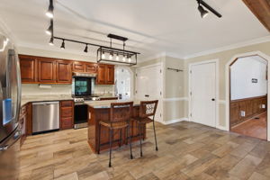Spacious Kitchen with Island, Pantry, & Stainless Appliances