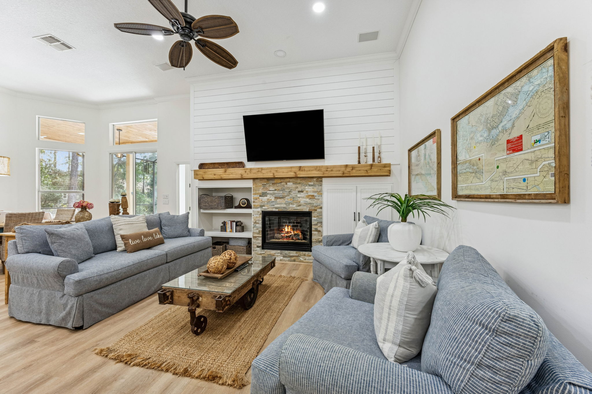 The family room is highlighted by a dramatic floor-to-ceiling shiplap wall ...