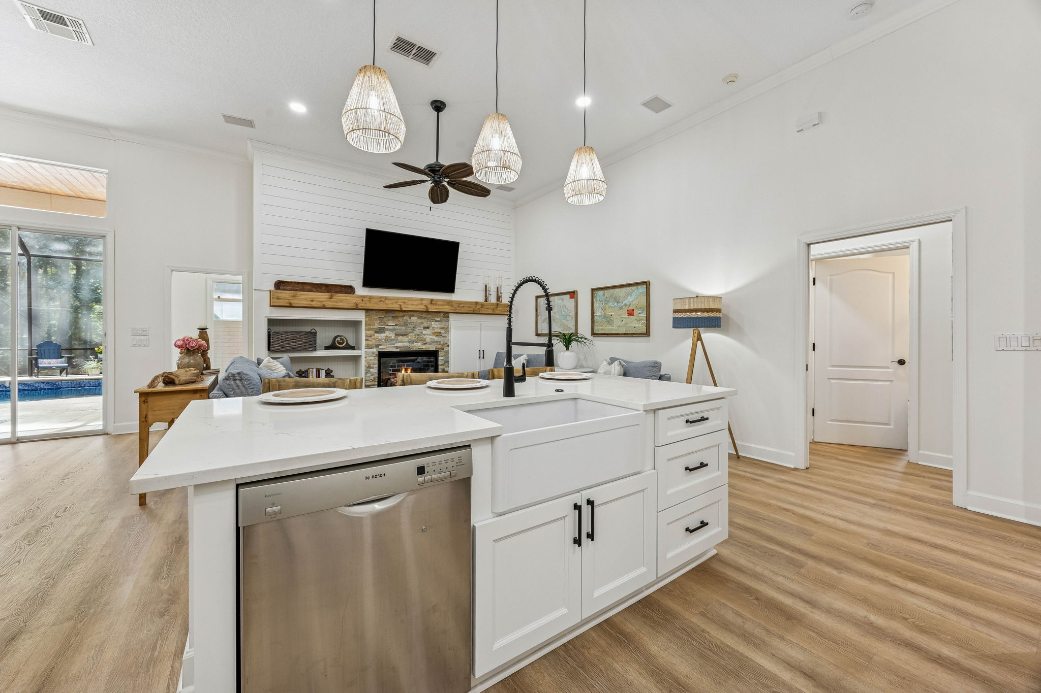 ... and Quartz surfaces combined with artisan backsplash tile that elevate the design