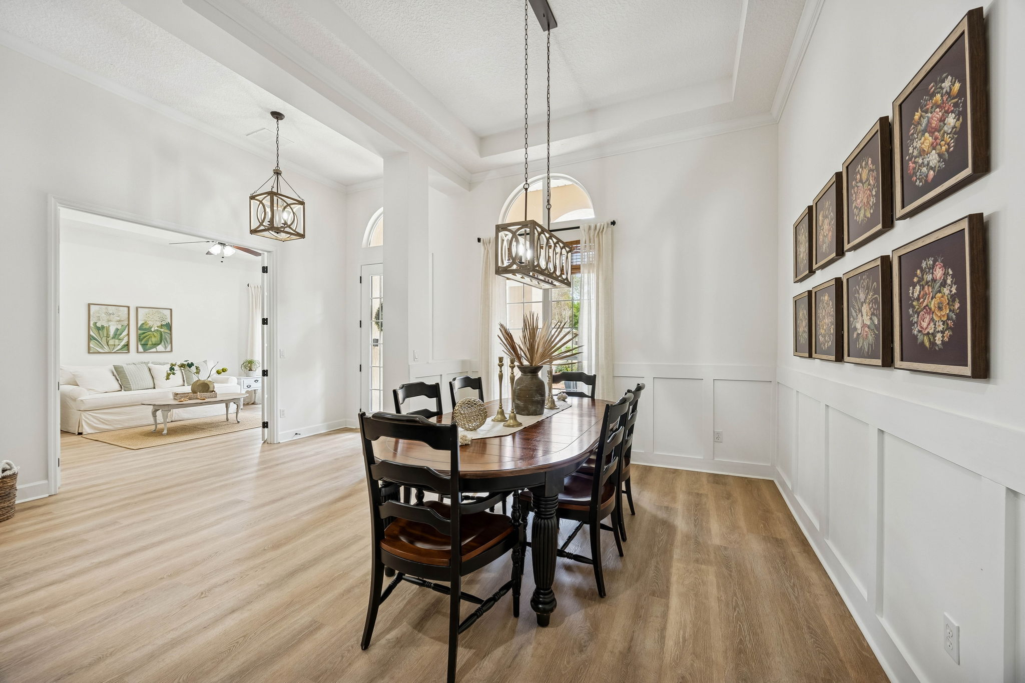 Across the hall is a refined dining room ...