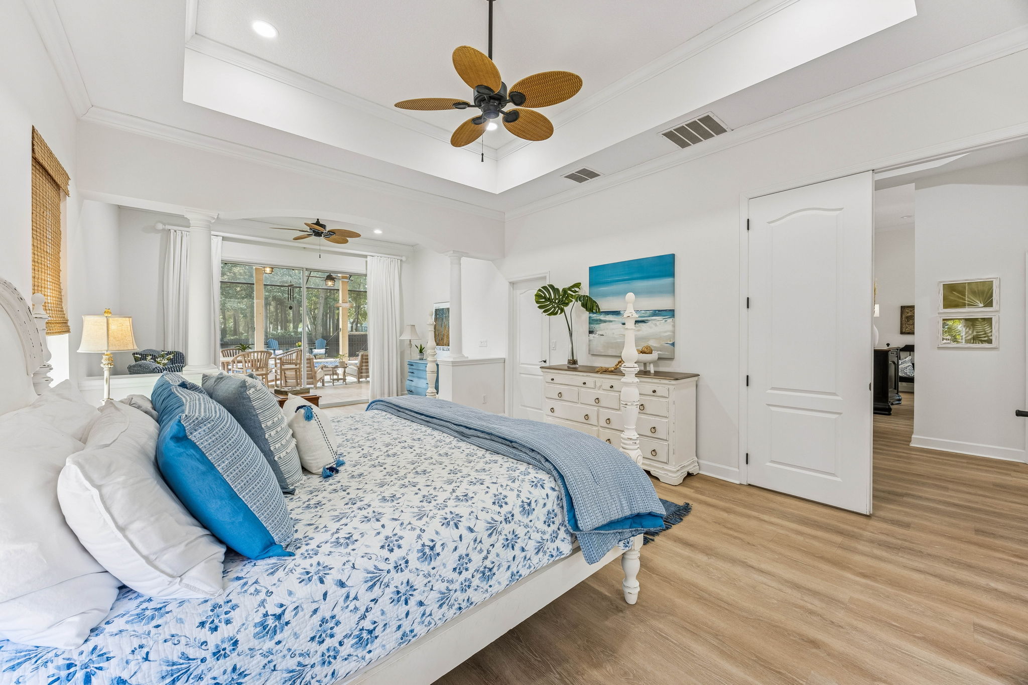 Tall tray ceilings, expansive windows, and sliding glass doors ...