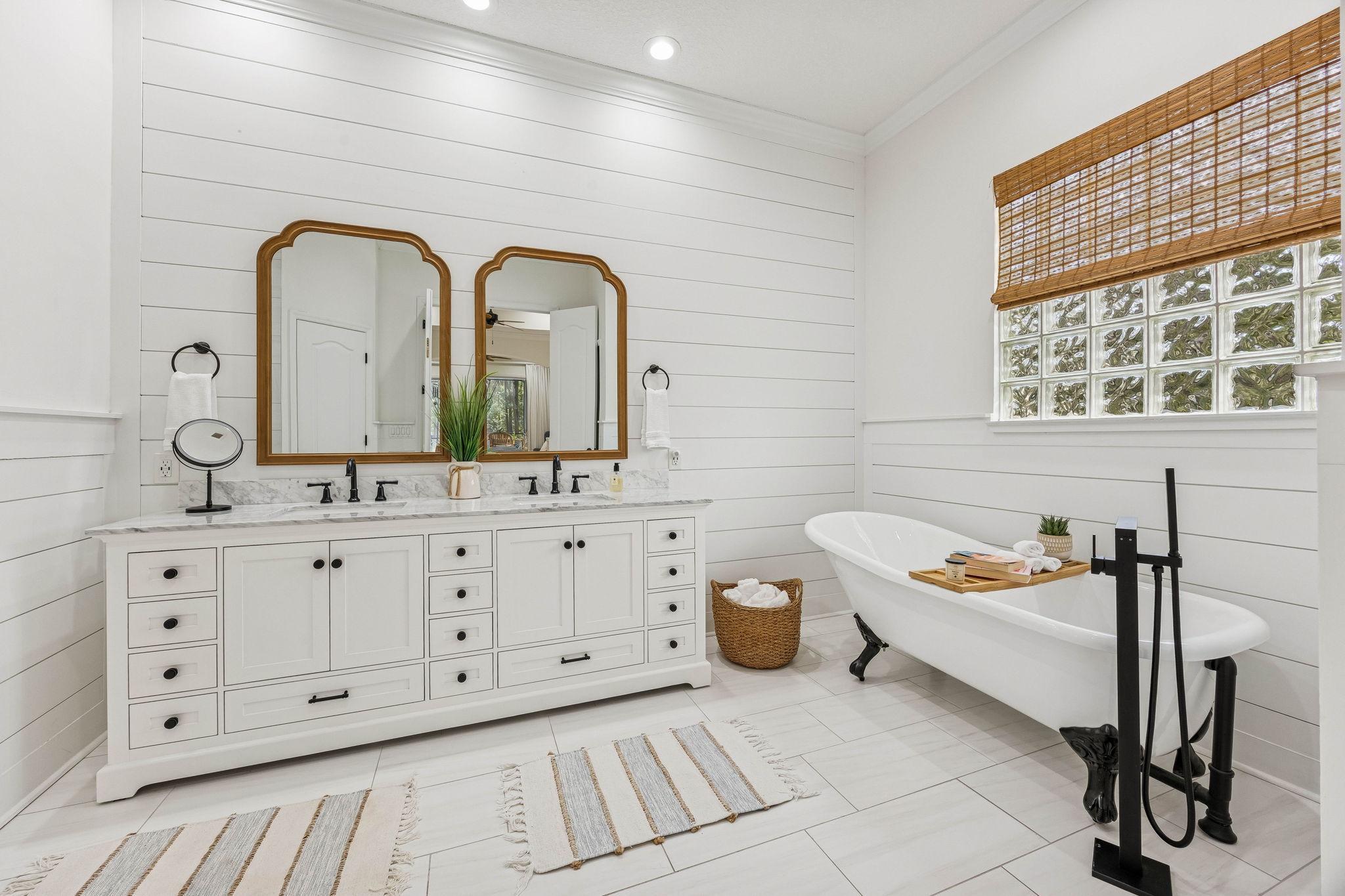 The refined primary bath is layered with custom detail ...