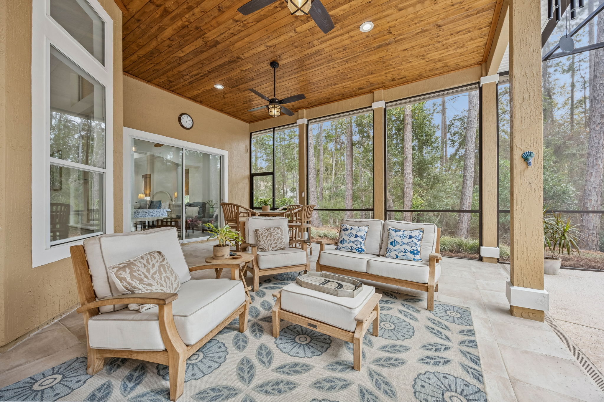 ... where a richly finished wood-paneled ceiling and dual ceiling fans