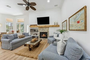 The family room is highlighted by a dramatic floor-to-ceiling shiplap wall ...