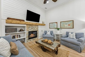 a gas stone fireplace, and a rough-hewn cedar mantle ...