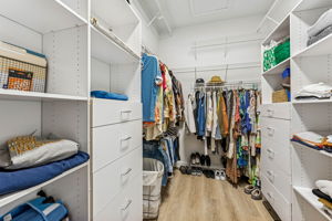 The primary closet is the size of two walk-ins, outfitted with custom organization