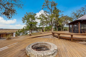 If features extensive decking, firepit, oyster roasting pit ...