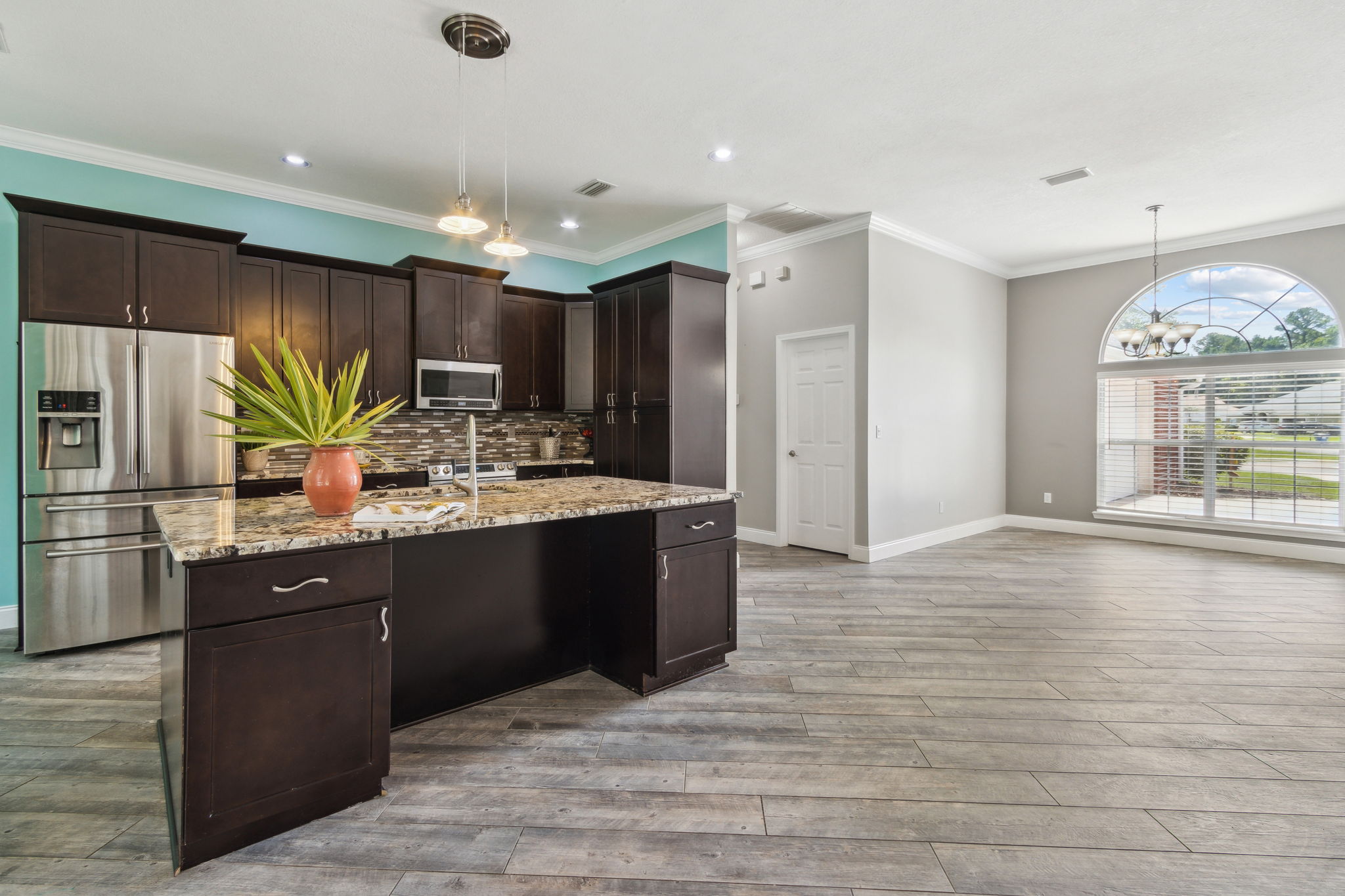 The large kitchen island has an eat-in breakfast bar..