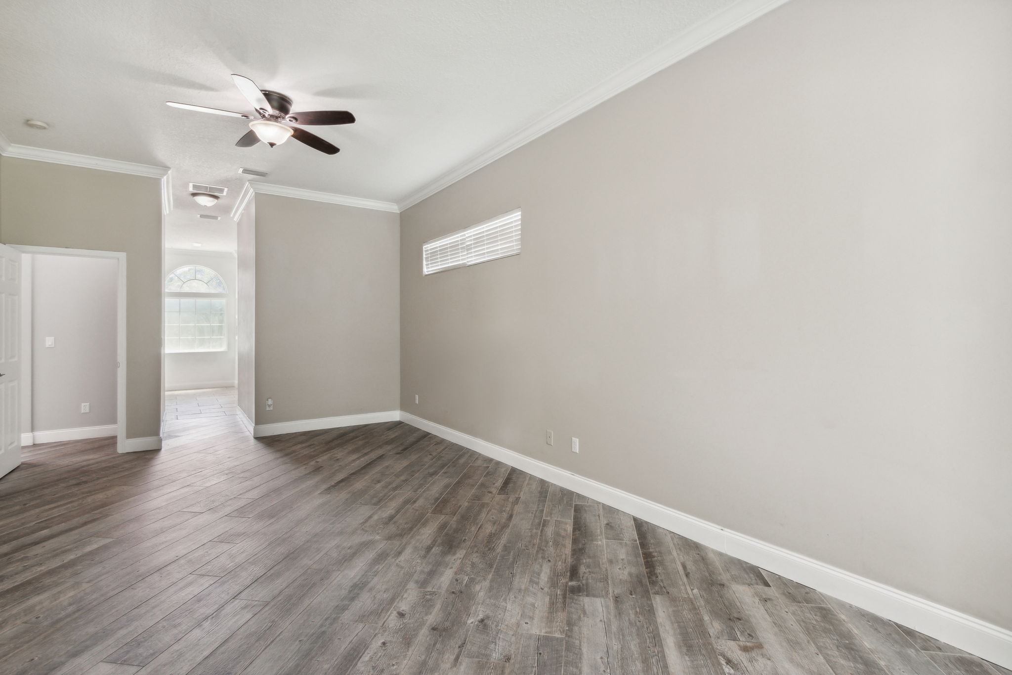 The master suite sports the same plank floors throughout most of the home