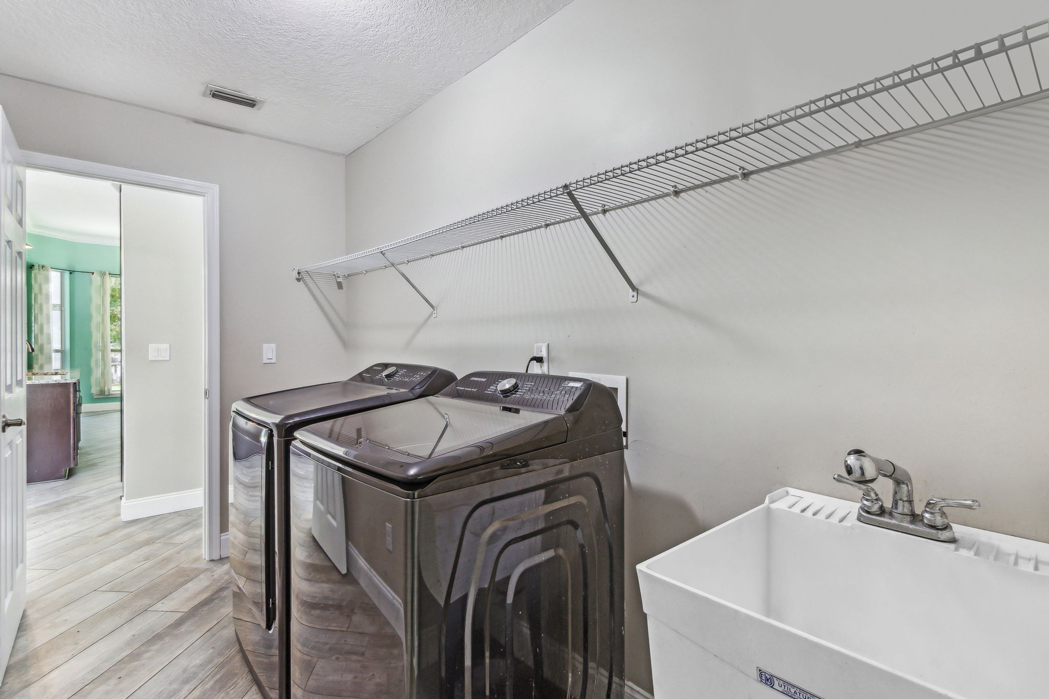 Another bonus: a laundry room with washer, dryer and utility sink.