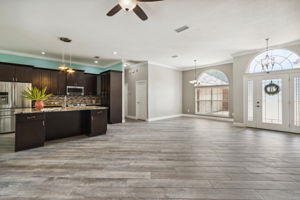 The home features upscale wood-look plank tile floors throughout all common areas ...