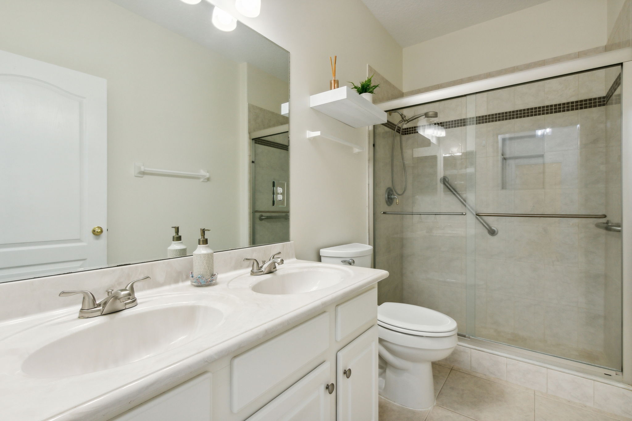 3rd bath with dual sinks and new toilet.