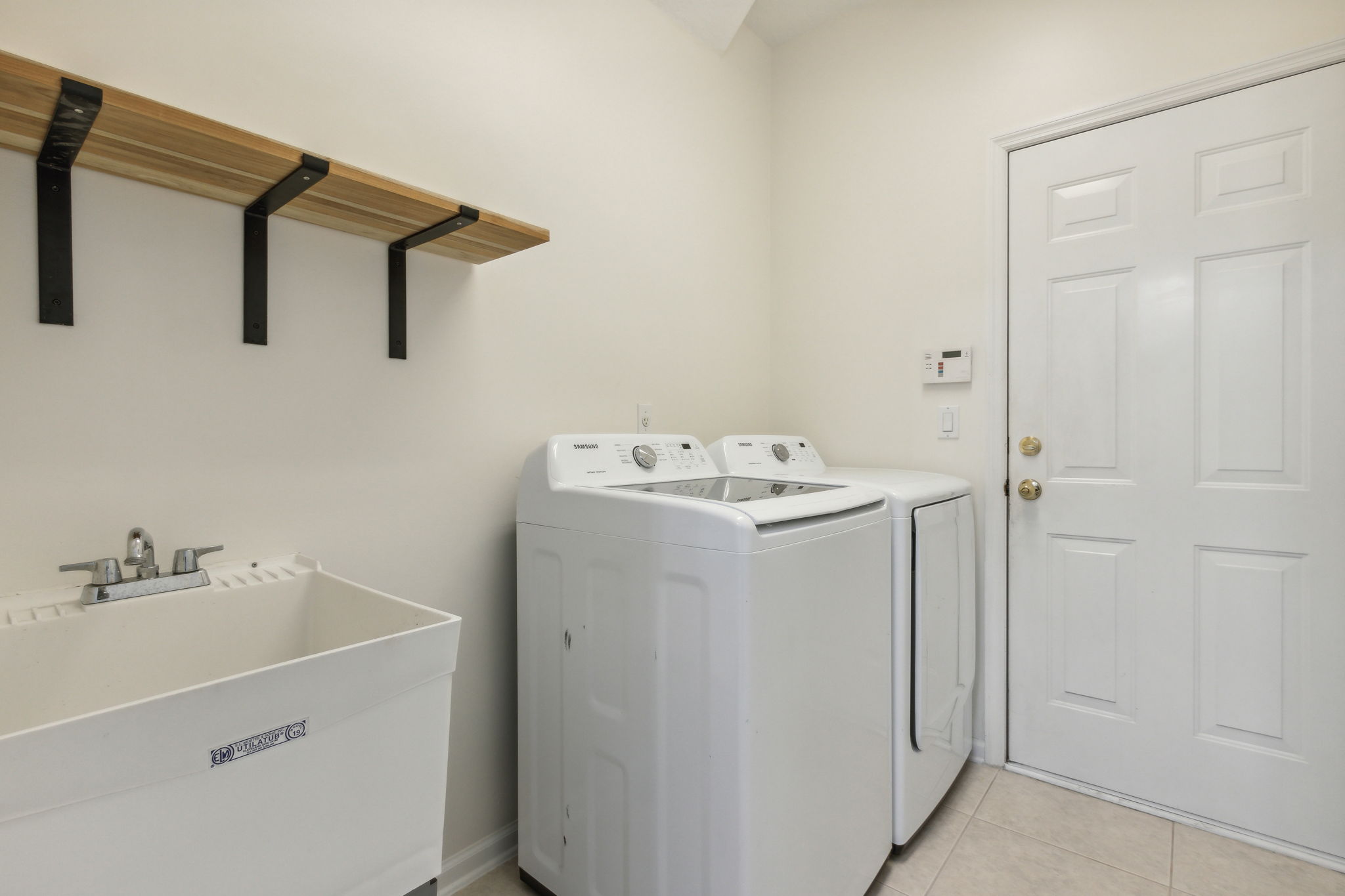 Laundry area with sink.