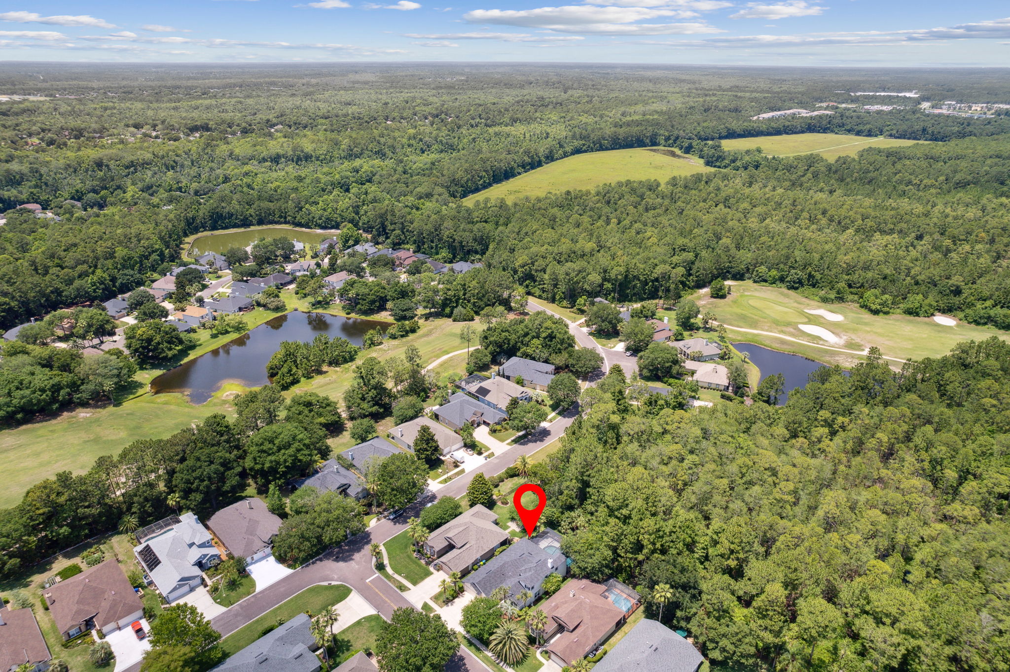 Aerial view of home located near the front of the neighborhood
