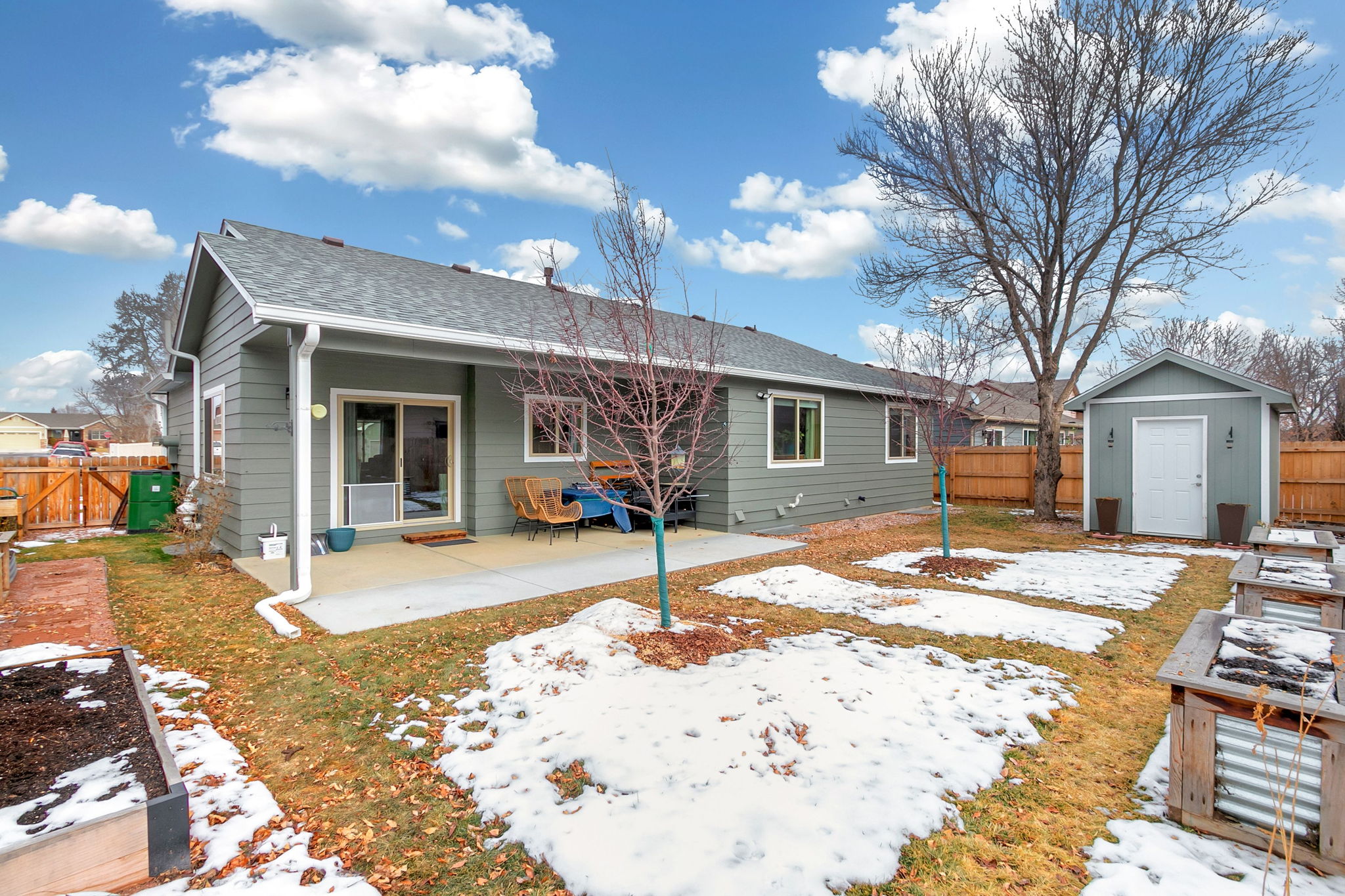 Spacious back yard with covered back patio. Wait until you see the landscaping bloom in the spring!