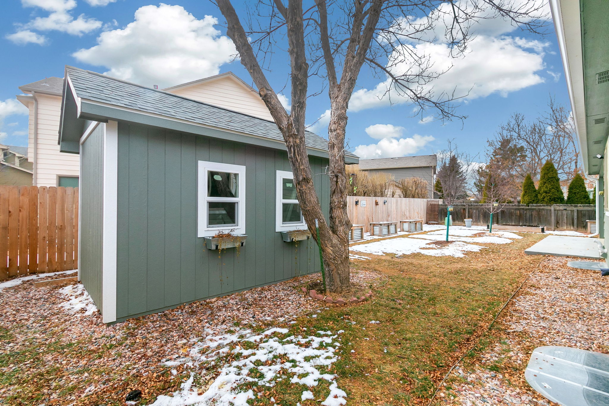 Custom-built shed sits on a concrete pad