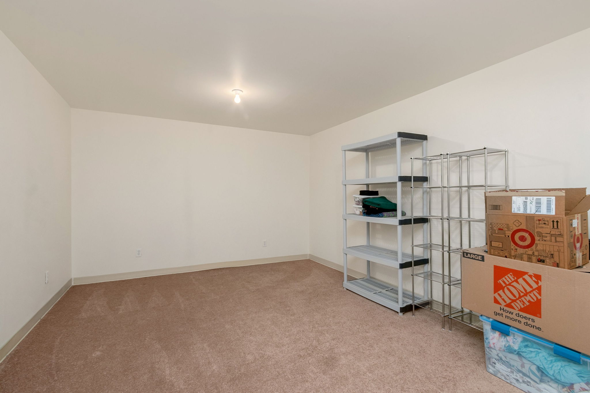 Finished room in basement could be used for an office, workout room, storage, etc