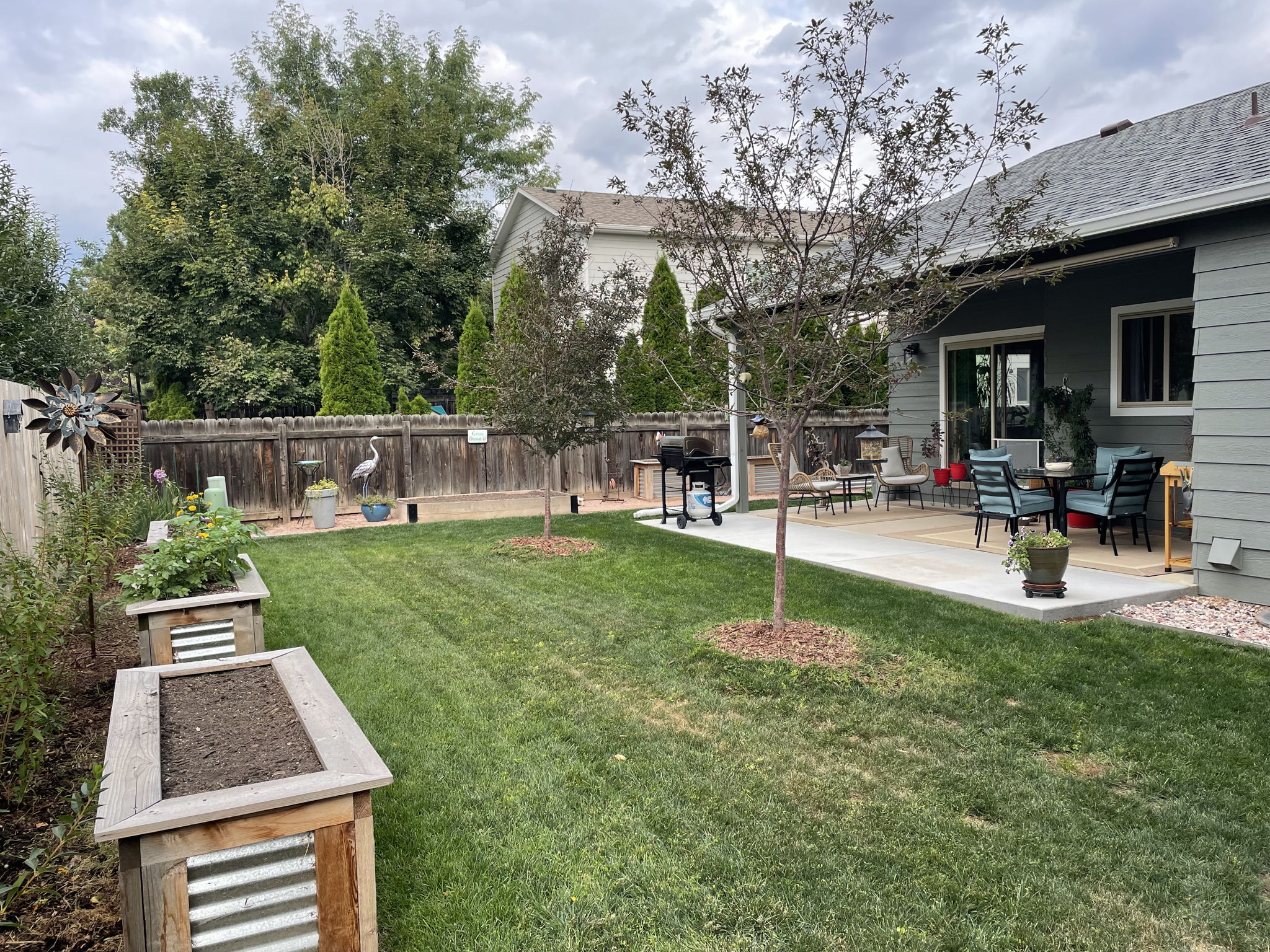 This photo is included to show how pretty the back yard landscaping is in the warm months