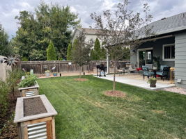 This photo is included to show how pretty the back yard landscaping is in the warm months