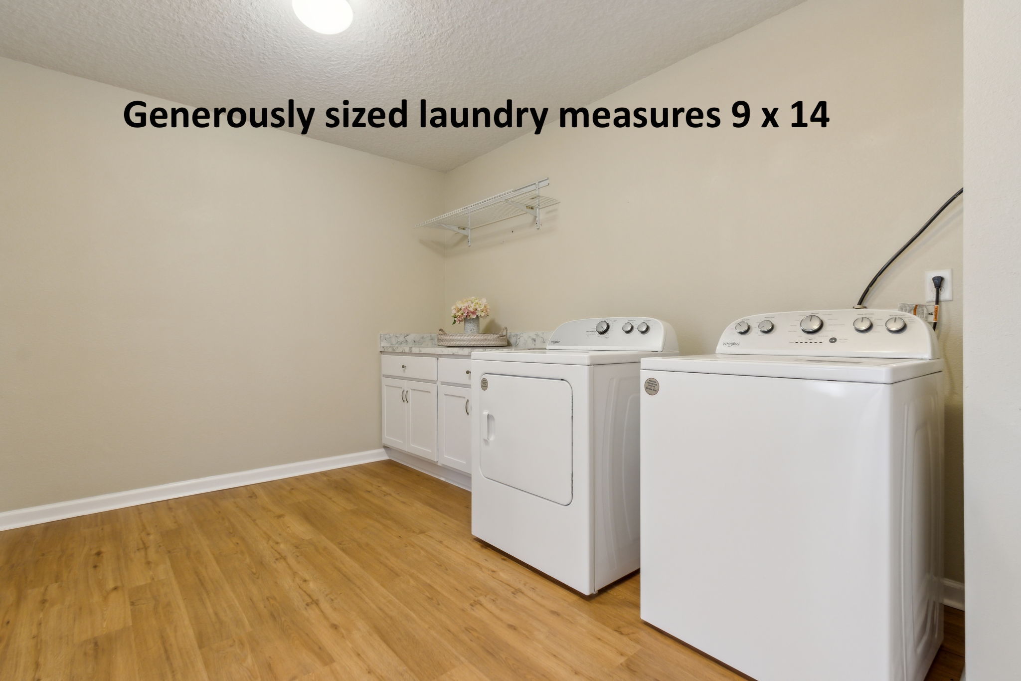 ... a spacious utility/mud room includes a new washer and dryer