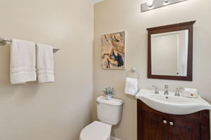 An updated half bath serves the 1st level