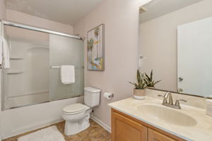 The guest bath features a shower/tub combo.