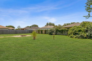...the fully fenced back yard is spacious ...